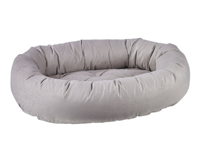 Donut Bed with oval bolster and tufted cushion in Sandstone.
