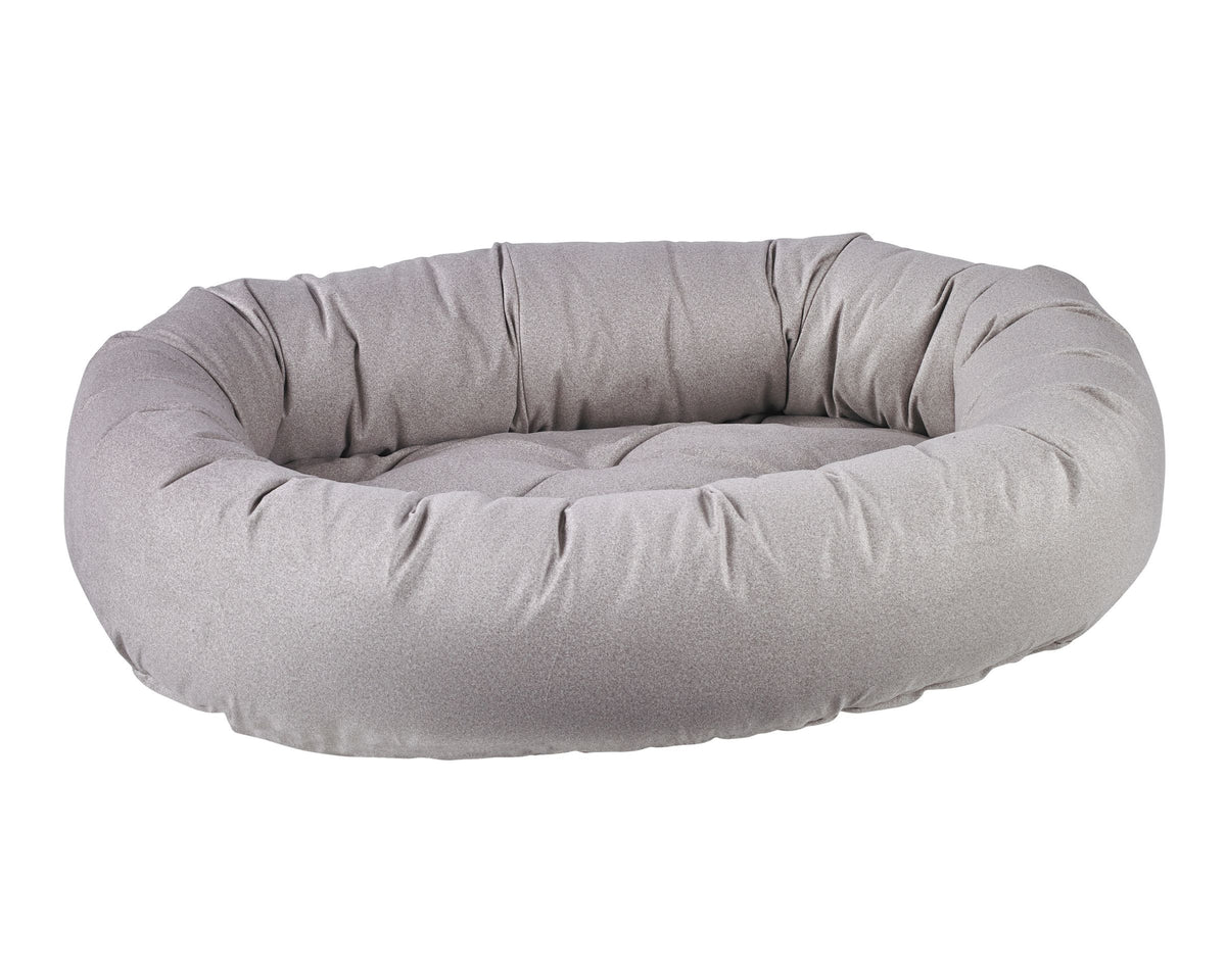 Donut Bed with oval bolster and tufted cushion in Sandstone.