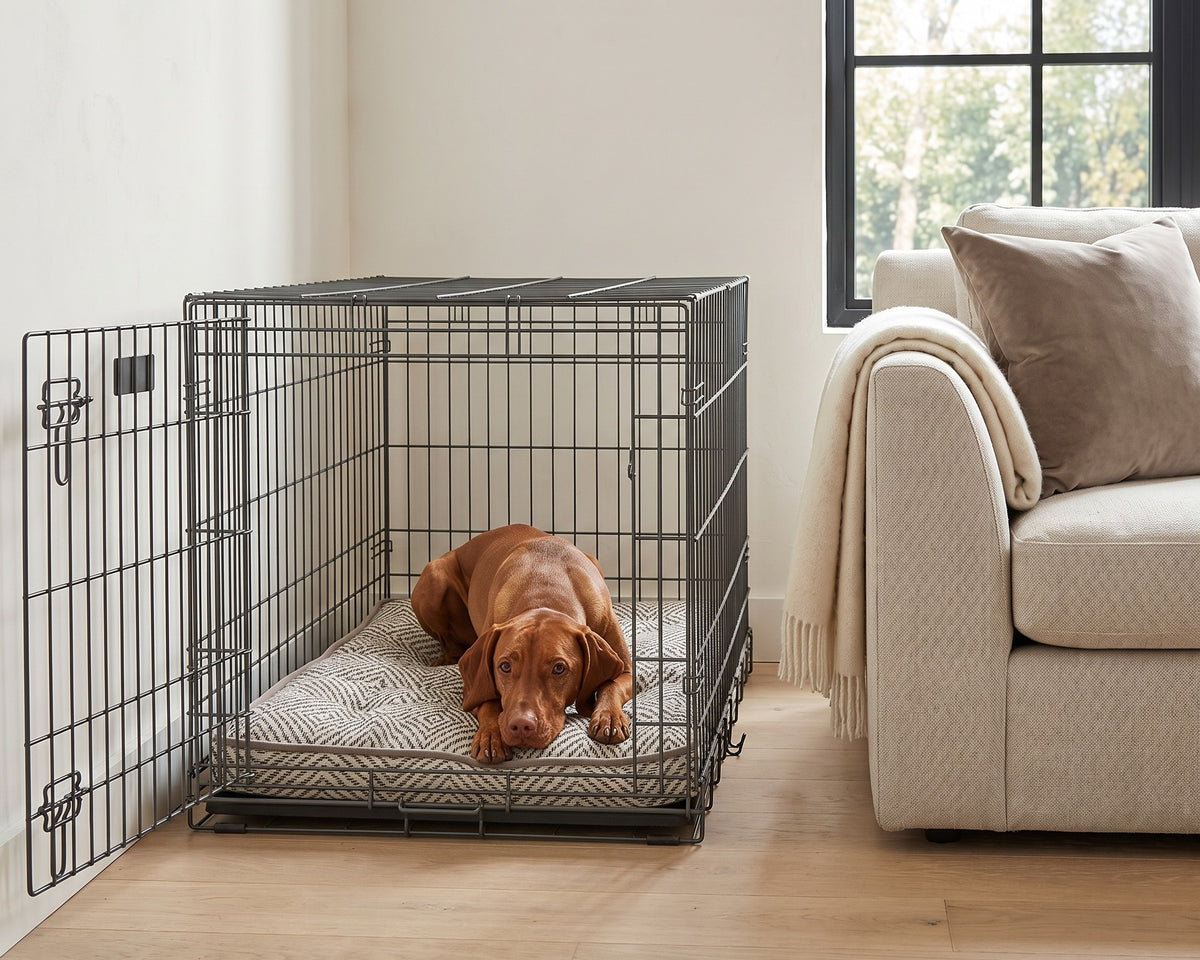 Vizsla resting on the Luxury Crate Mattress in Diamondback inside a wire crate in a living room